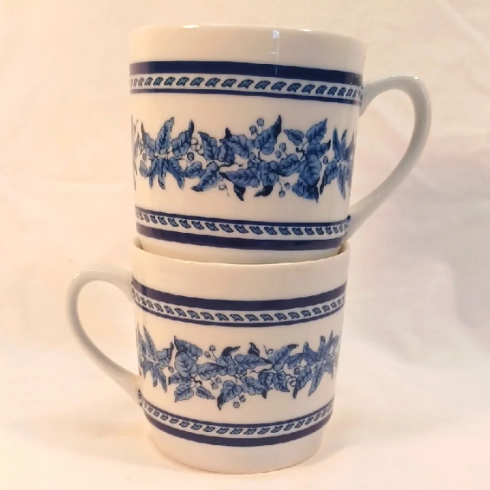 Set of 2 Williams-Sonoma Blue and White Leaf Band Mugs.